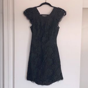 Black mini dress. Backless. Lace detail